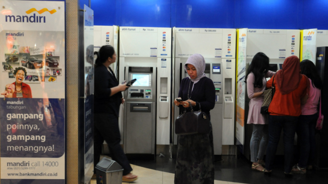 Anjungan Tunai Mandiri. 