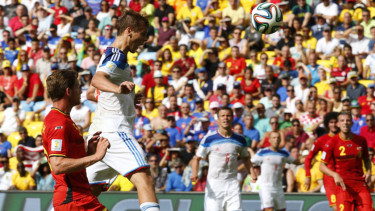 Kesebelasan Rusia (berkostum putih) saat tampil di Piala Dunia 2014.