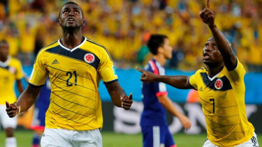 Jackson Martinez (21) usai membobol gawang Jepang. 