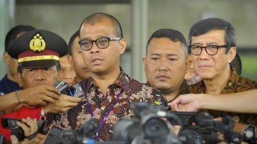 Andi Widjajanto saat bersama Yasonna Laoly.