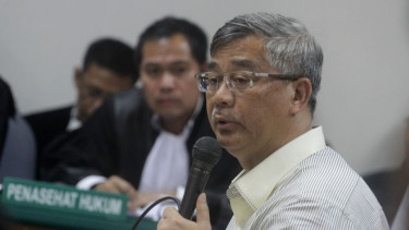 Akil Mochtar saat bersaksi di sidang Bonaran Situmeang.