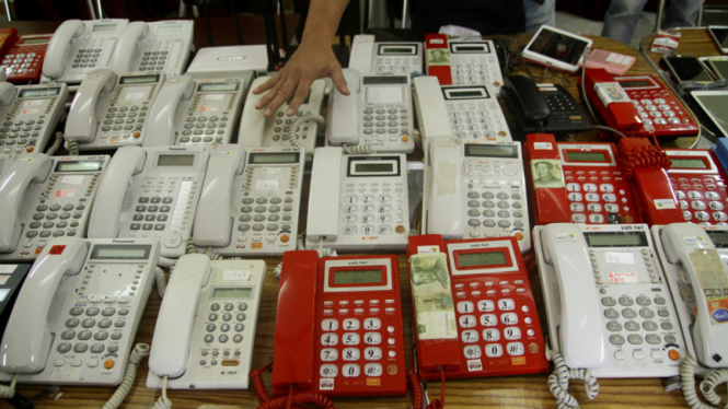 Ilustrasi penipuan menggunakan telepon.