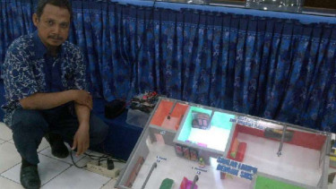 Alat pengendali perabot rumah tangga melalui SMS 