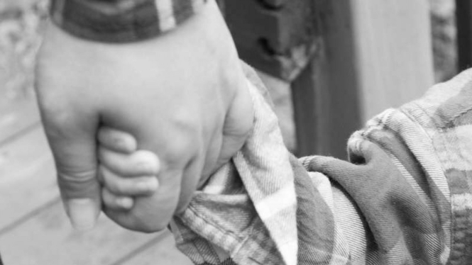 Children and parent holding hand