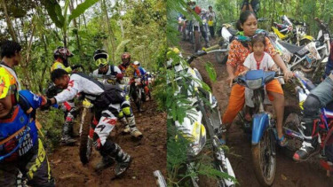 Seorang ibu melintas di jalur off-road dengan motor bebek.