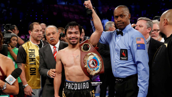 Kalahkan Vargas, Pacquiao rebut gelar WBO.
