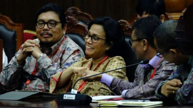 Reaksi Menteri Keuangan Sri Mulyani saat mendengarkan keputusan MK.