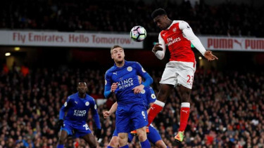 Sundulan pemain Arsenal, Daniel Welbeck.
