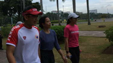 Menteri BUMN Rini Soemarno dan Sandiaga Uno.