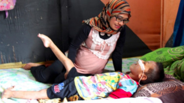 Salah satu anak laki-laki dalam asuhan paliatif bersama Rachel House