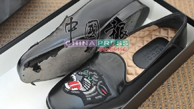Sepatu Gucci yang solnya rusak