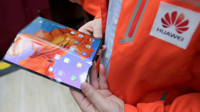 Ponsel Lipat Karya Musuh" Amerika Serikat Siap Salip Samsung. (FOTO: REUTERS/Jason Lee)"