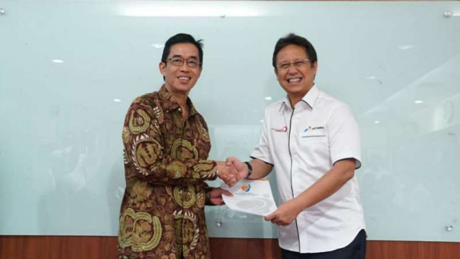 Dirut PLN Zulkifli Zaini dan Wakil Menteri BUMN Budi Gunadi Sadikin.