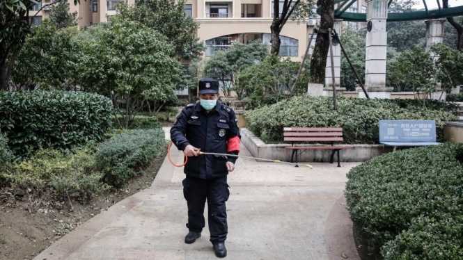 Wuhan residents are trying to stay indoors and take precautions to stop the outbreak spreading - Getty Images