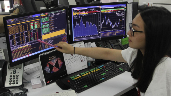 Layar monitor pergerakan saham dan IHSG