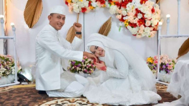 Brigadir T Murizal Saputra bersama istrinya, Maya Karmila.