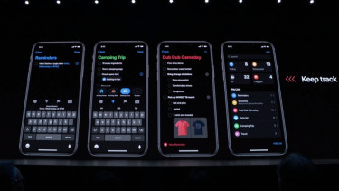 Fitur dark mode pada iPhone Apple.