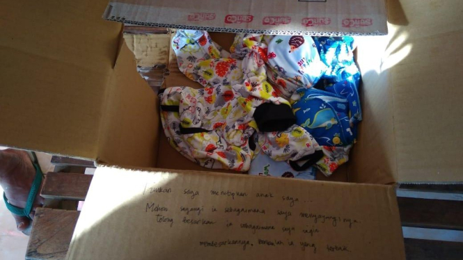Tulisan di kardus yang dipakai untuk membuang bayi di Yogyakarta