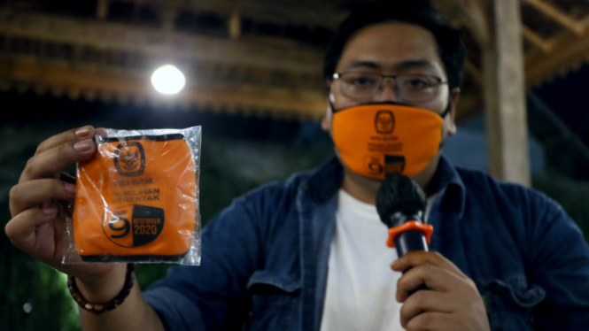 Ilustrasi sosialisasi penggunaan masker.