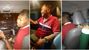 Pengemudi taksi di Thailand bekerja dengan bantuan tabung oksigen