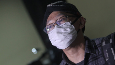 Abu Janda, saat jalani pemeriksaan di Bareskrim Mabes Polri