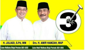 Poster Juliadi (kiri) dan Amir Hamzah di Pilkada
