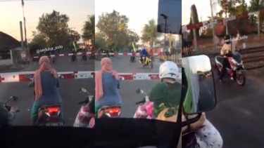 Pengendara Motor Nekat Terobos Palang Pintu Kerete Api (Instagram/sedulur_solo)