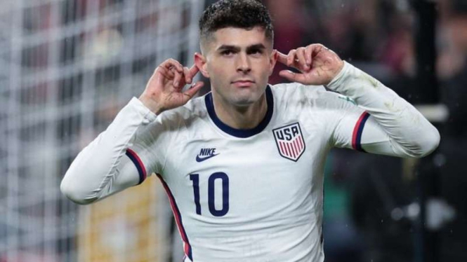 Gelandang Amerika Serikat, Christian Pulisic rayakan gol