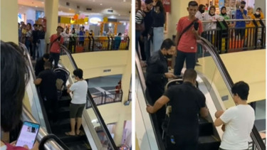 Stroller nyangkut di eskalator