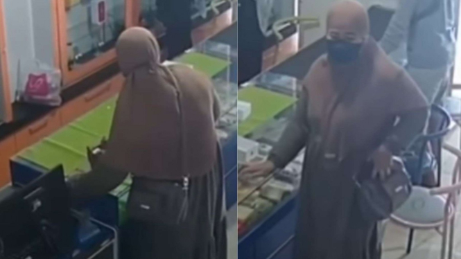 Ibu-ibu berhijab curi HP di konter