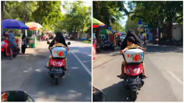 Emak-emak suruh anaknya pegang kuali saat dibonceng