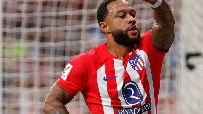 Pemain Atletico Madrid Memphis Depay rayakan gol