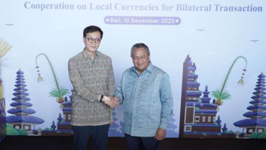 Kerja sama penggunaan uang lokal Korea dan Indonesia.