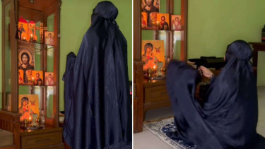 Kristen Orthodox sholat di depan foto Yesus dan lilin yang menyala