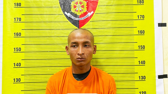 IAN alias Pian, pelaku perampokan turis Perancis saat diamankan petugas kepolisian.(dok Polda Sumut)