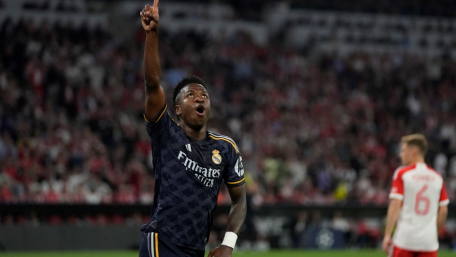 Pemain Real Madrid, Vinicius Junior rayakan gol.