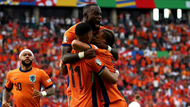 Timnas Belanda merayakan gol