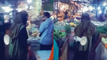 Perempuan Bercadar Peringati Pedagang Pasar untuk Salat Jumat