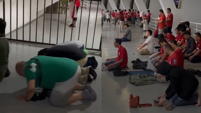 Adem, Momen Suporter Timnas Indonesia dan Arab Saudi Salat Berjemaah