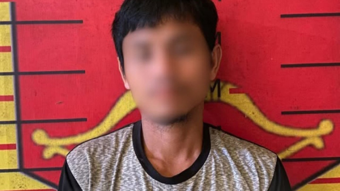 SN, pelaku pembunuhan terhadap seorang ASN saat diamankan petugas kepolisian.(dok Polres Nias Selatan)