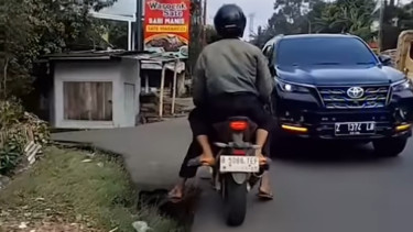 Fortuner pelat sipil dikawal hampir mencelakai pengguna motor