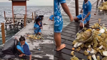 Anak-anak Papua bersihkan laut.