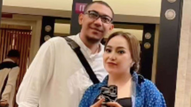 Mpok Alpa dan suaminya