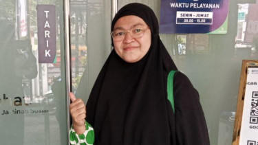 Peserta JKN, Dewi Rhomadi Ani